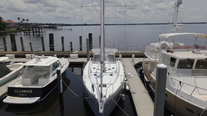 Slide: The Image of Beneteau Oceanis 40.1 yacht docked at marina, 2022 model, surrounded by other boats. - 3
