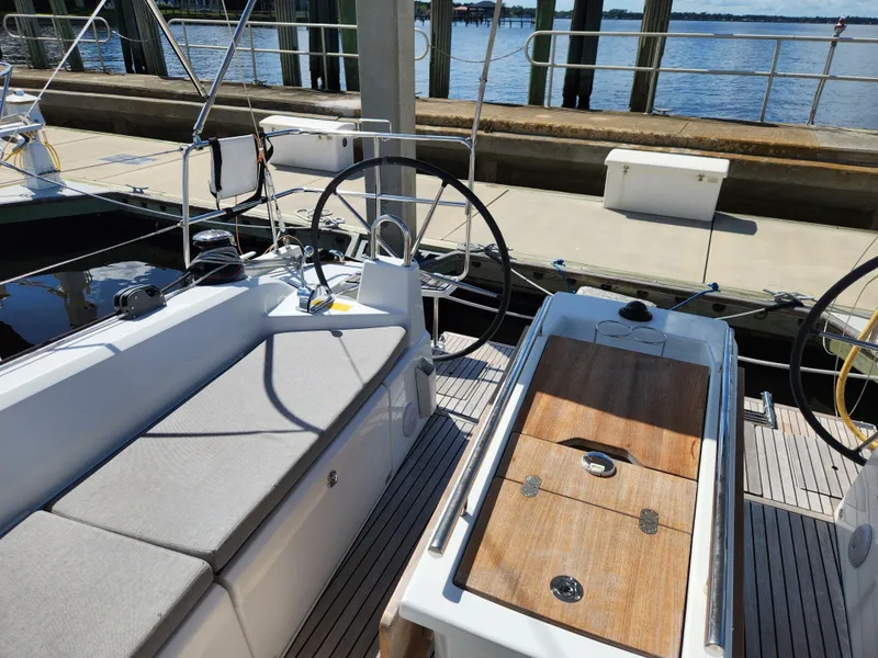 Slide: The Image of Beneteau Oceanis 40.1 sailboat cockpit, 2022 model, docked at marina with dual steering wheels. - 30