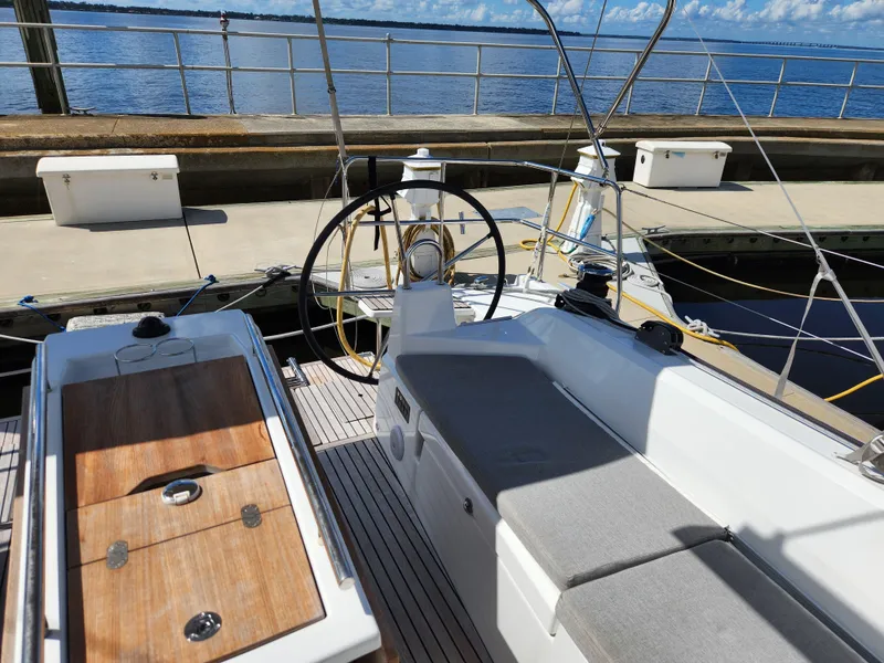 Slide: The Image of Cockpit view of 2022 Beneteau Oceanis 40.1 sailboat docked by the water. - 31