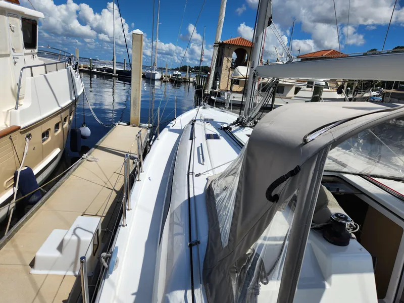 Slide: The Image of 2022 Beneteau Oceanis 40.1 sailboat docked at marina under blue sky. - 45