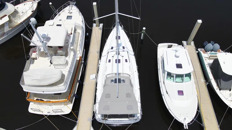 Slide: The Image of Beneteau Oceanis 40.1 yacht docked between boats, aerial view, 2022 model. - 6