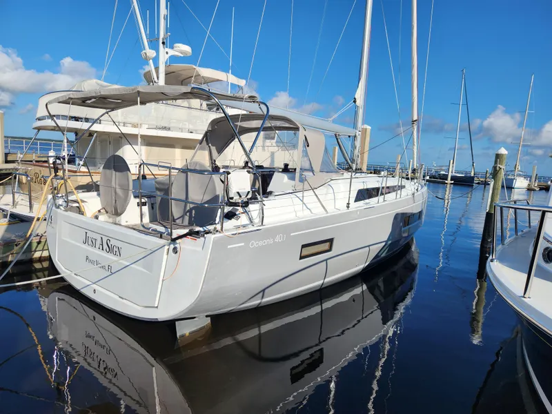 Slide: The Image of 2022 Beneteau Oceanis 40.1 sailboat docked at marina under clear blue sky. - 8