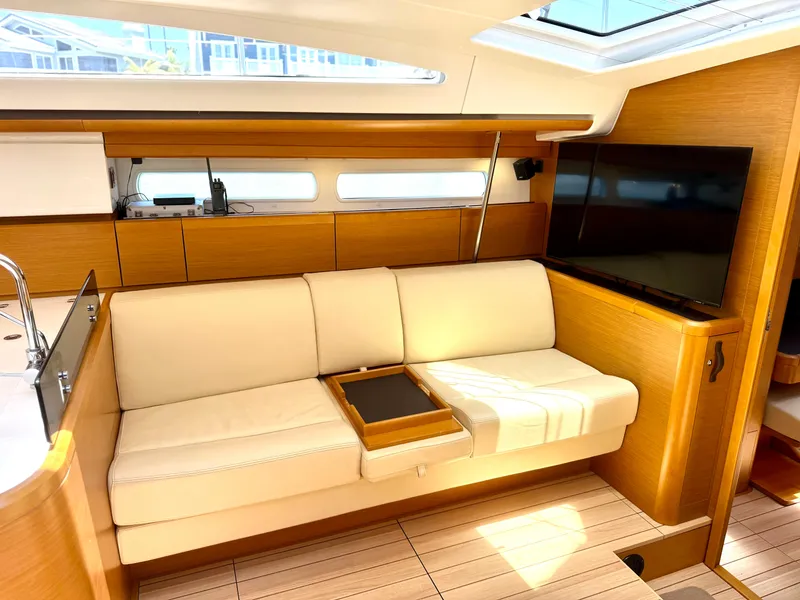 Slide: The Image of Luxurious interior of 2018 Jeanneau 58 yacht with cream sofa and modern amenities. - 12