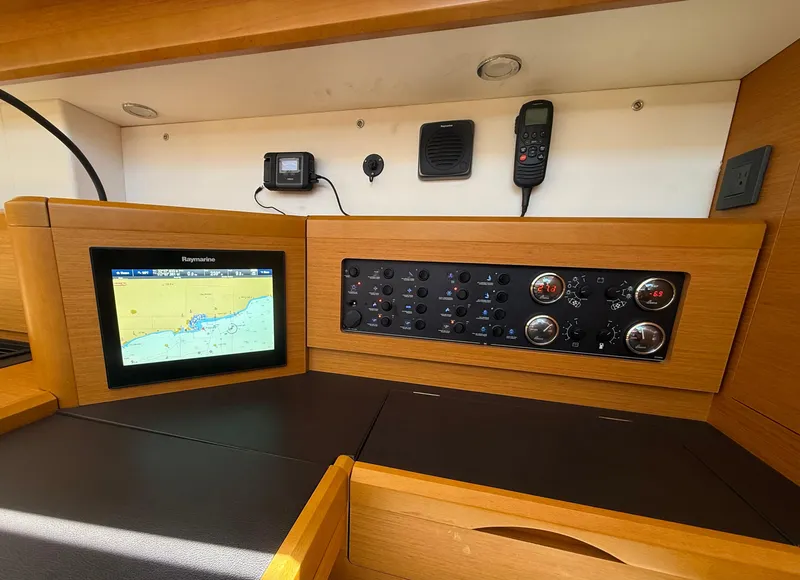 Slide: The Image of Control panel of a 2018 Jeanneau 58 yacht with navigation display and instruments. - 16