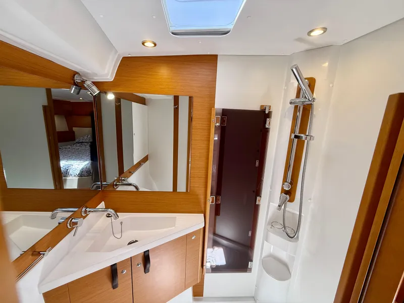 Slide: The Image of Luxurious bathroom in 2018 Jeanneau 58 yacht with modern fixtures and wooden accents. - 20