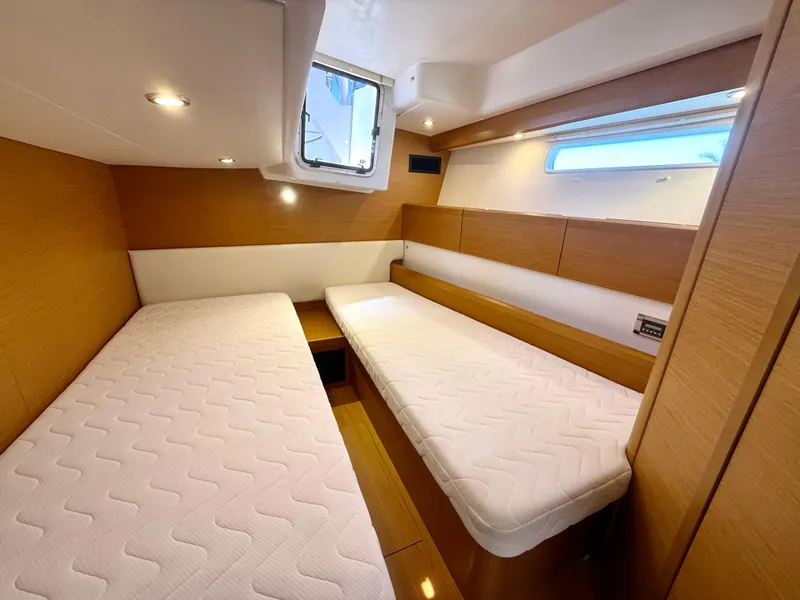 Slide: The Image of Interior cabin of 2018 Jeanneau 58 yacht with twin beds and modern design. - 22