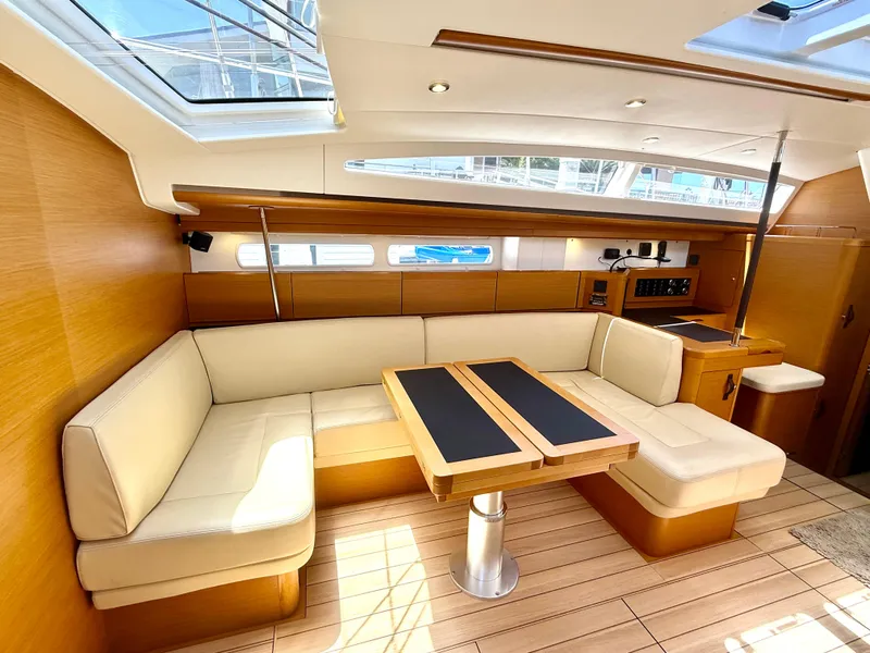 Slide: The Image of Luxurious interior of 2018 Jeanneau 58 yacht with elegant seating and wooden finishes. - 3