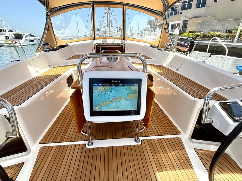 Slide: The Image of Cockpit of 2018 Jeanneau 58 yacht with navigation display and teak flooring. - 35