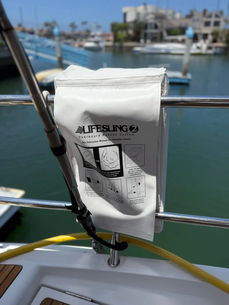 Slide: The Image of Lifesling 2 rescue system on Jeanneau 58 yacht, 2018 model, docked at marina. - 43