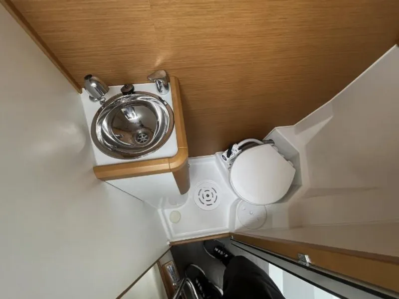 Slide: The Image of Compact bathroom in 2018 Jeanneau 58 yacht with sink and toilet. - 44