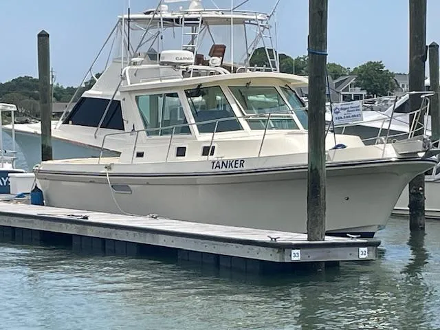 Slide: The Image of 2001 Albin 31' Tournament Express boat docked at marina. - 1