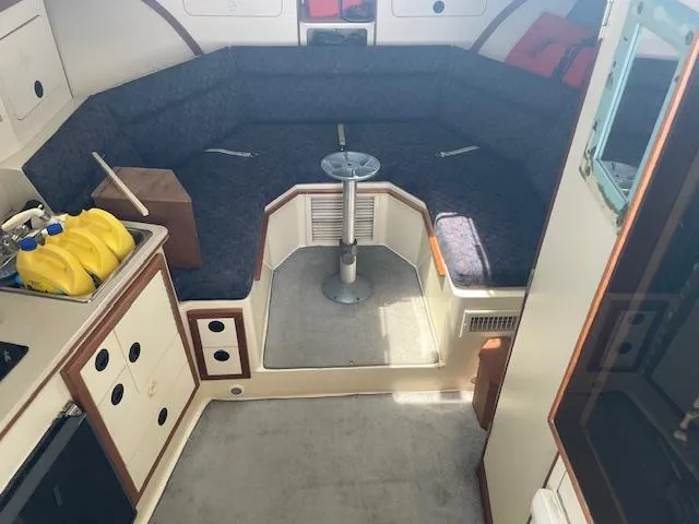 Slide: The Image of Interior of 2001 Albin 31' Tournament Express boat with seating and storage. - 13