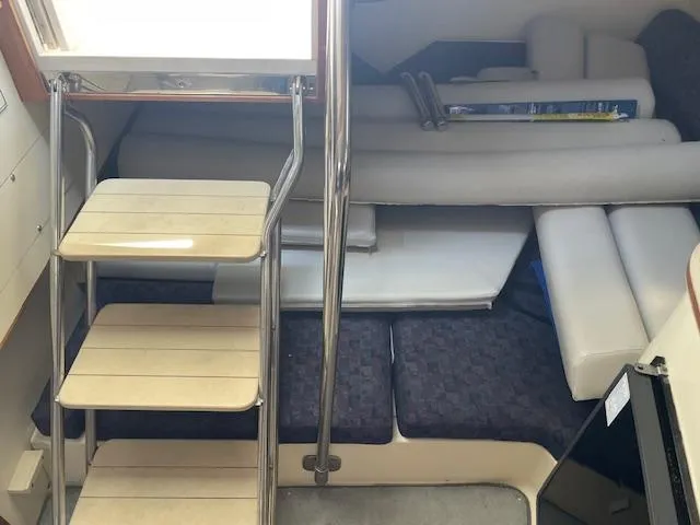 Slide: The Image of 2001 Albin 31' Tournament Express cabin interior with stairs and seating area. - 14