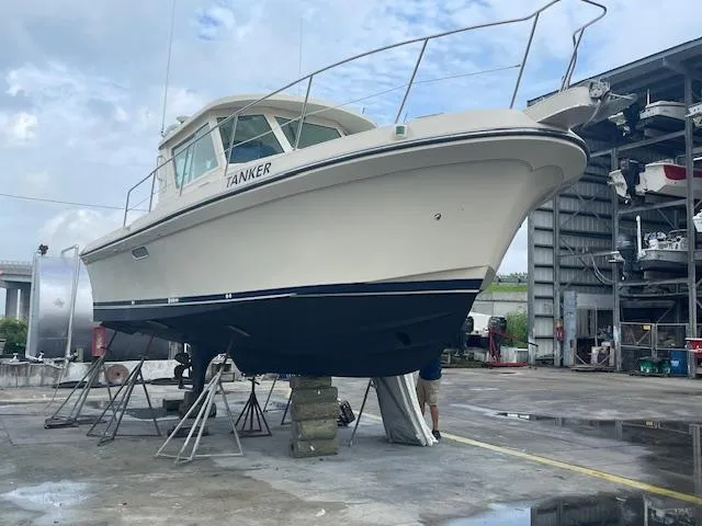 Slide: The Image of 2001 Albin 31' Tournament Express boat on dry dock for maintenance. - 17