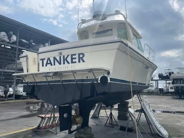 Slide: The Image of 2001 Albin 31' Tournament Express boat named "Tanker" in a boatyard. - 21
