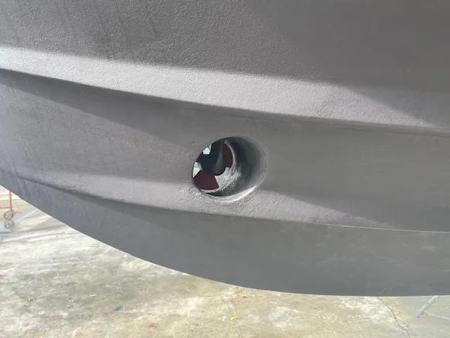 Slide: The Image of Close-up of a 2001 Albin 31' Tournament Express hull with a bow thruster. - 23