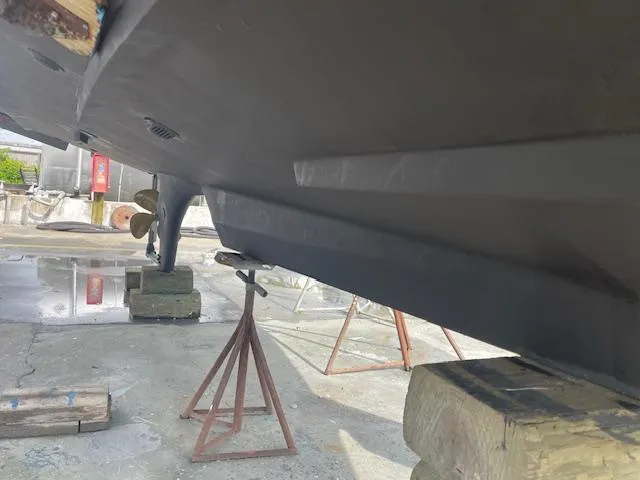 Slide: The Image of Bottom view of a 2001 Albin 31' Tournament Express boat on stands. - 24