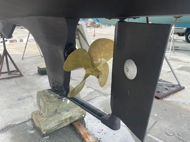 Slide: The Image of Propeller and rudder of 2001 Albin 31' Tournament Express boat on dry dock. - 26