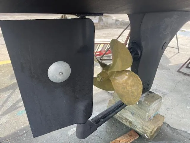 Slide: The Image of Propeller and rudder of 2001 Albin 31' Tournament Express boat on dry dock. - 27