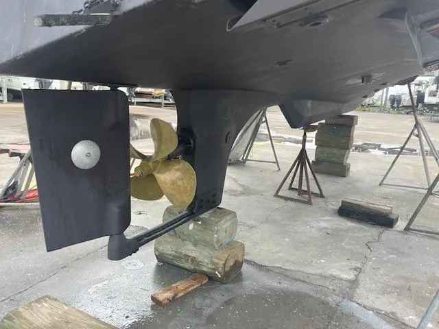Slide: The Image of 2001 Albin 31' Tournament Express boat propeller and rudder on dry dock. - 28