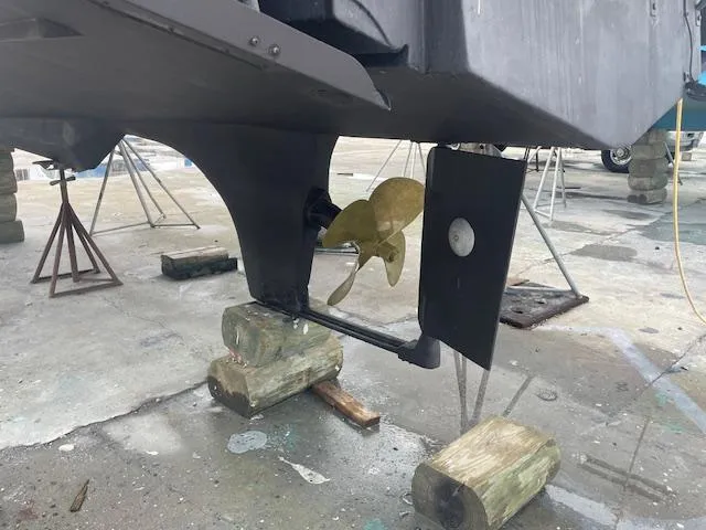 Slide: The Image of Propeller and rudder of a 2001 Albin 31' Tournament Express boat on blocks. - 29
