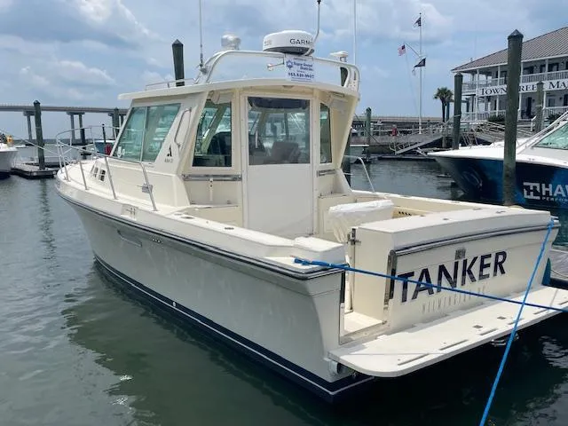 Slide: The Image of 2001 Albin 31' Tournament Express boat docked at marina, named "TANKER." - 3