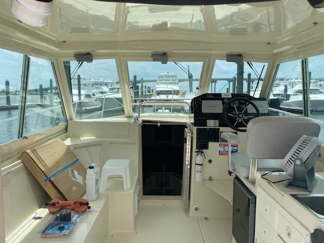 Slide: The Image of Interior view of a 2001 Albin 31' Tournament Express boat at a marina. - 4