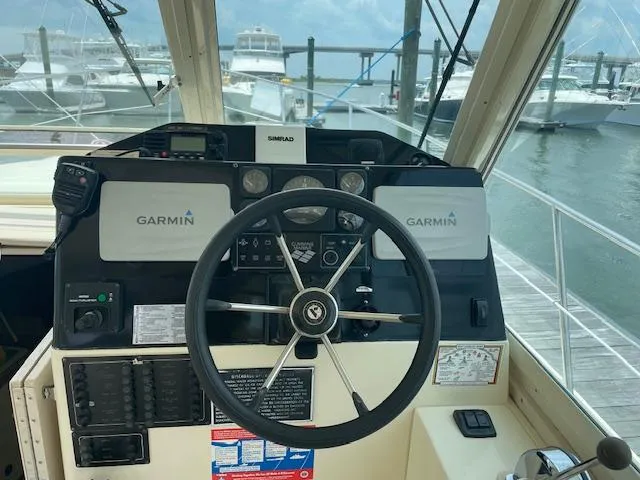 Slide: The Image of Helm of 2001 Albin 31' Tournament Express with Garmin navigation, docked at marina. - 6