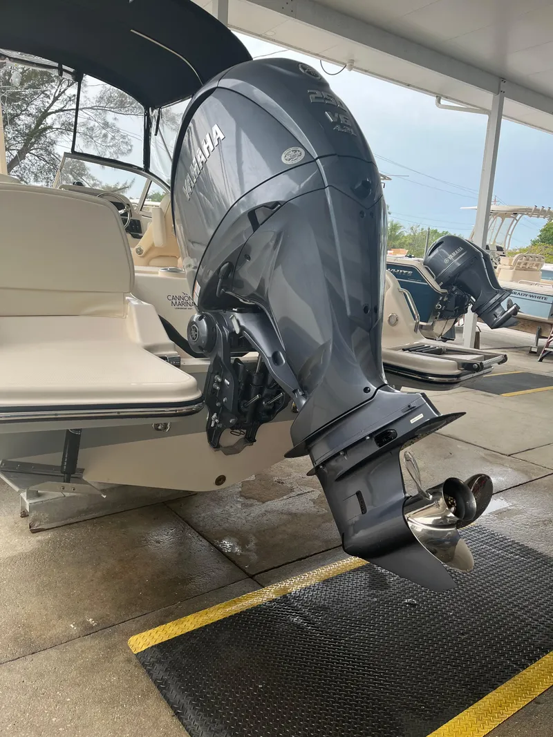Slide: The Image of 2022 Grady-White Freedom 215 boat with Yamaha outboard motor in a showroom. - 1