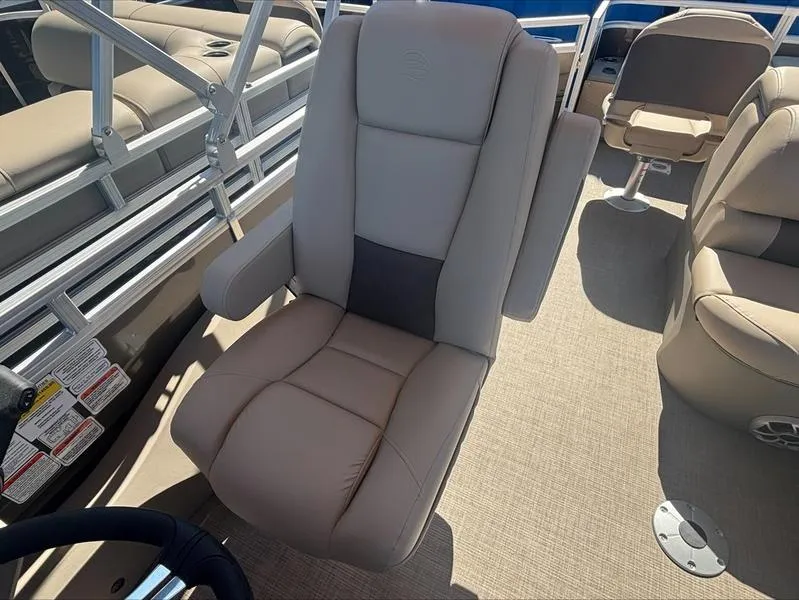 Slide: The Image of Captain's chair on 2025 Sun Tracker SportFish™ 22 DLX pontoon boat, beige upholstery. - 2