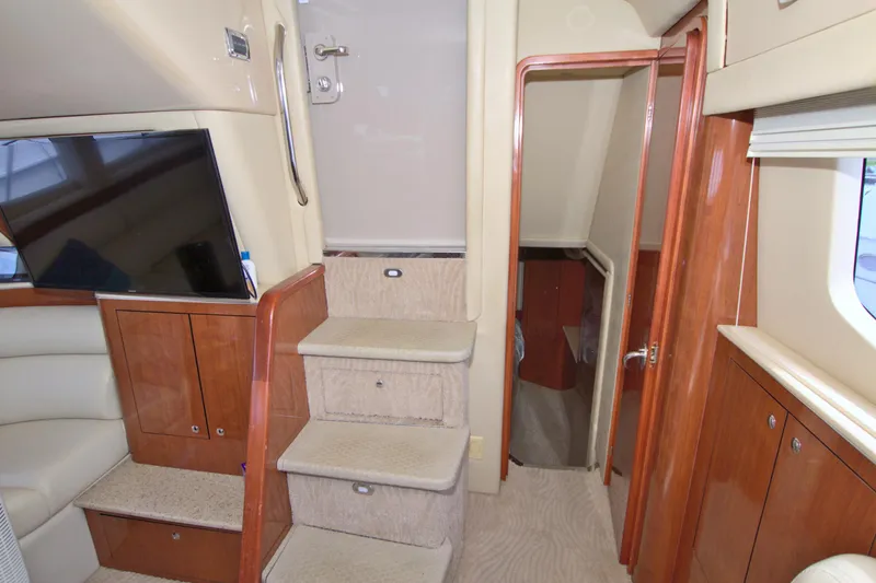 Slide: The Image of Interior of 2003 Sea Ray 480 Motor Yacht with stairs and wooden cabinetry. - 33