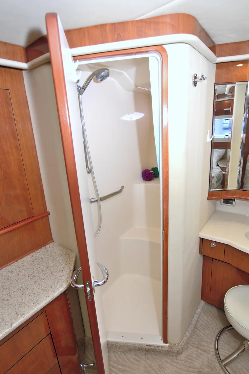 Slide: The Image of Shower area in 2003 Sea Ray 480 Motor Yacht with wooden cabinetry and modern fixtures. - 37
