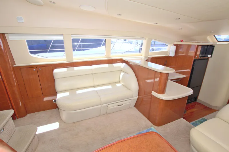 Slide: The Image of Luxurious interior of 2003 Sea Ray 480 Motor Yacht with plush seating and elegant wood finishes. - 42