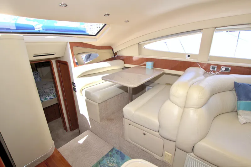 Slide: The Image of Luxurious interior of 2003 Sea Ray 480 Motor Yacht with plush seating and dining area. - 45