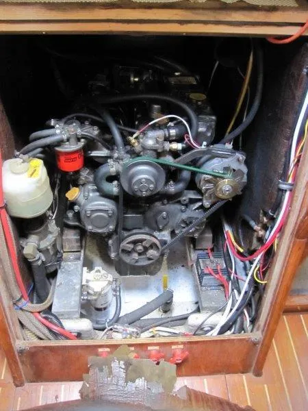 Slide: The Image of Engine compartment of a 1990 Jeanneau Sun Magic 44 sailboat, showing detailed mechanical components. - 17
