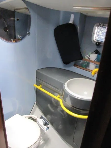 Slide: The Image of Bathroom interior of 1990 Jeanneau Sun Magic 44 yacht with sink and toilet. - 2