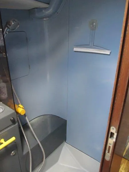 Slide: The Image of Shower area inside a 1990 Jeanneau Sun Magic 44 sailboat, featuring a compact design. - 3