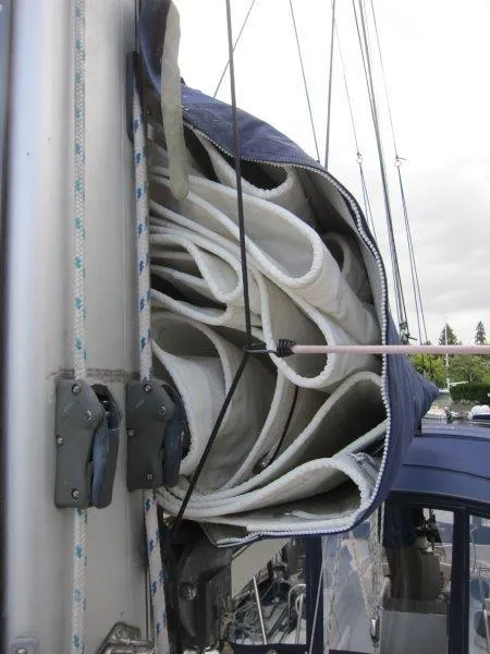 Slide: The Image of Rolled sail on Jeanneau Sun Magic 44, 1990 model, with visible rigging and mast details. - 34