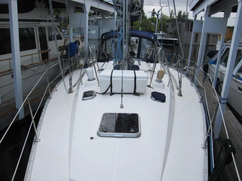 Slide: The Image of Jeanneau Sun Magic 44 sailboat deck, 1990 model, docked in a marina. - 37