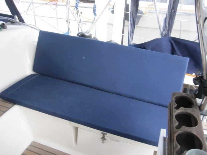 Slide: The Image of Blue cushioned seating on 1990 Jeanneau Sun Magic 44 sailboat deck. - 41