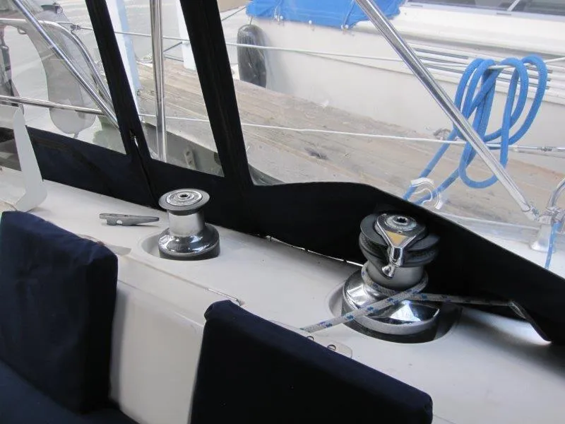 Slide: The Image of Cockpit view of 1990 Jeanneau Sun Magic 44 sailboat with winches and ropes. - 43