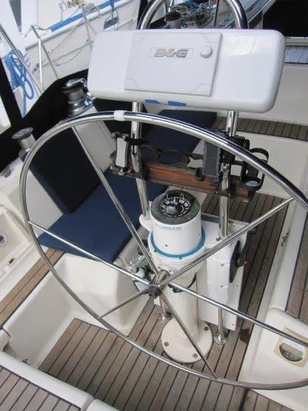 Slide: The Image of Steering wheel of 1990 Jeanneau Sun Magic 44 sailboat with navigation equipment. - 45