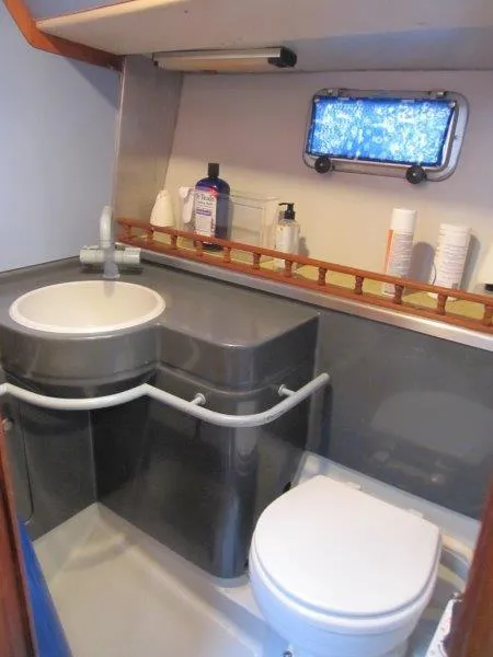 Slide: The Image of Bathroom interior of 1990 Jeanneau Sun Magic 44 yacht with sink and toilet. - 7