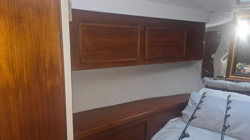 Slide: The Image of Interior of 1984 Ocean Yachts 46 Super Sport with seating and marina view. - 19