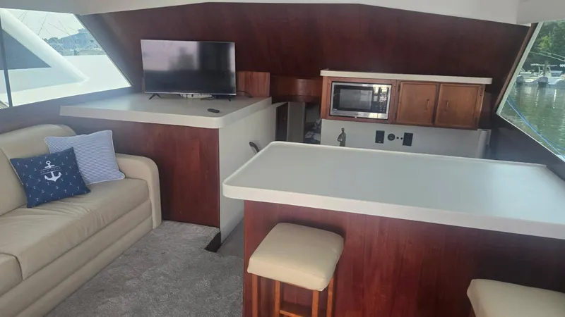 Slide: The Image of Twin beds in a cozy cabin of a 1984 Ocean Yachts 46 Super Sport. - 25