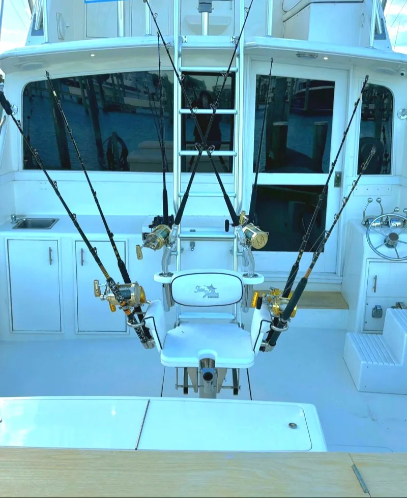 Slide: The Image of 1984 Ocean Yachts 46 Super Sport boat named "In 2 Deep" docked in a marina. - 3