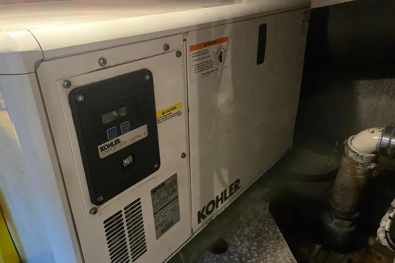 Slide: The Image of Kohler generator in 1984 Ocean Yachts 46 Super Sport engine room. - 38