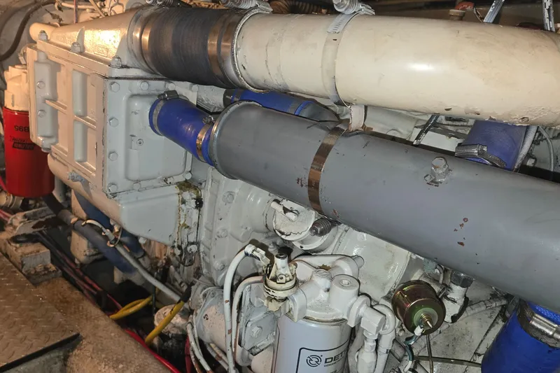 Slide: The Image of Engine compartment of a 1984 Ocean Yachts 46 Super Sport, showcasing mechanical components. - 40