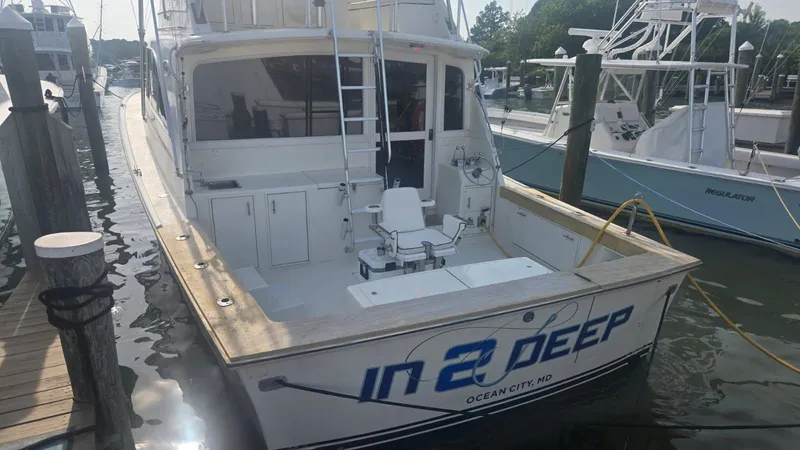 Slide: The Image of 1984 Ocean Yachts 46 Super Sport fishing cockpit with multiple rods and reels. - 8