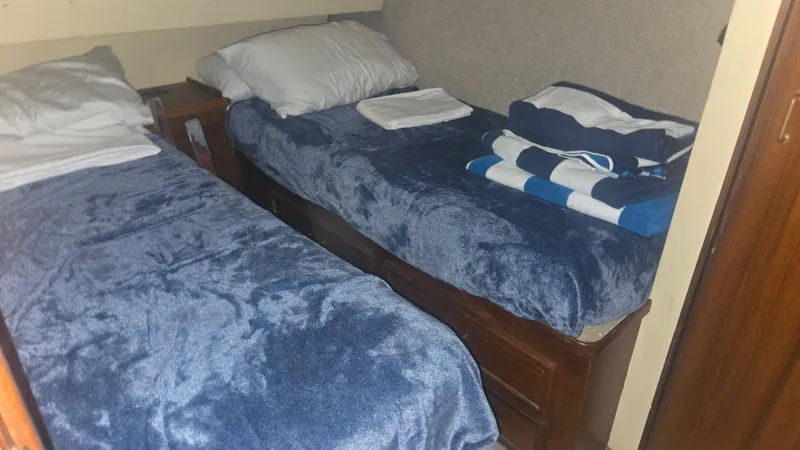 Slide: The Image of 1984 Ocean Yachts 46 Super Sport cockpit with storage compartment, dockside view. - 17